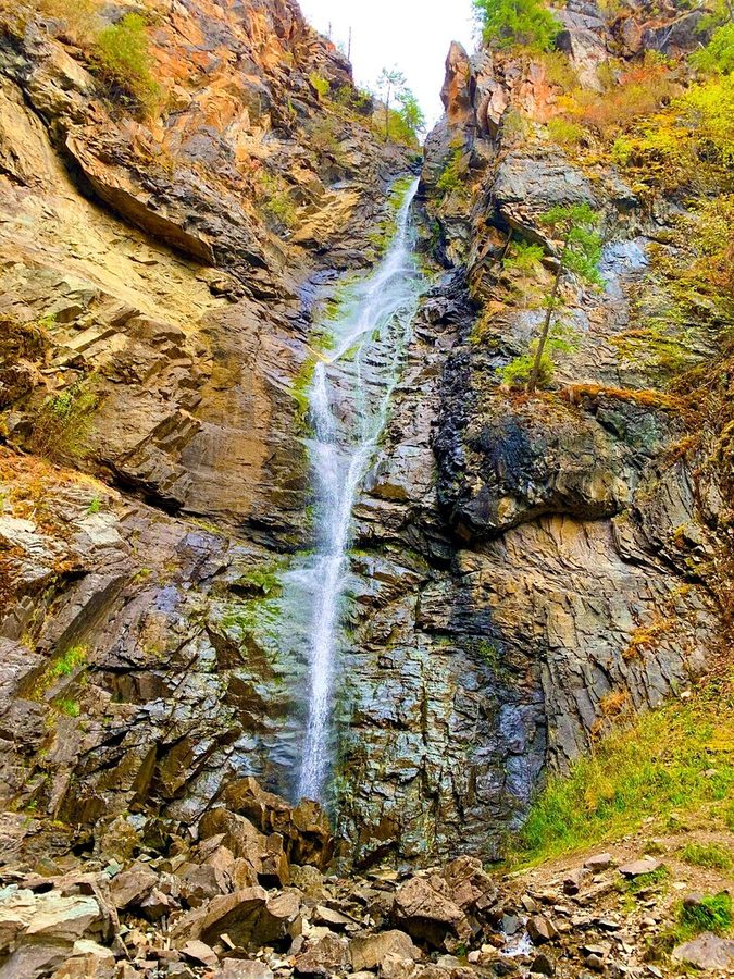 Copper Falls, Idaho — a narrow ribbon of water plunging down a steep rock face.