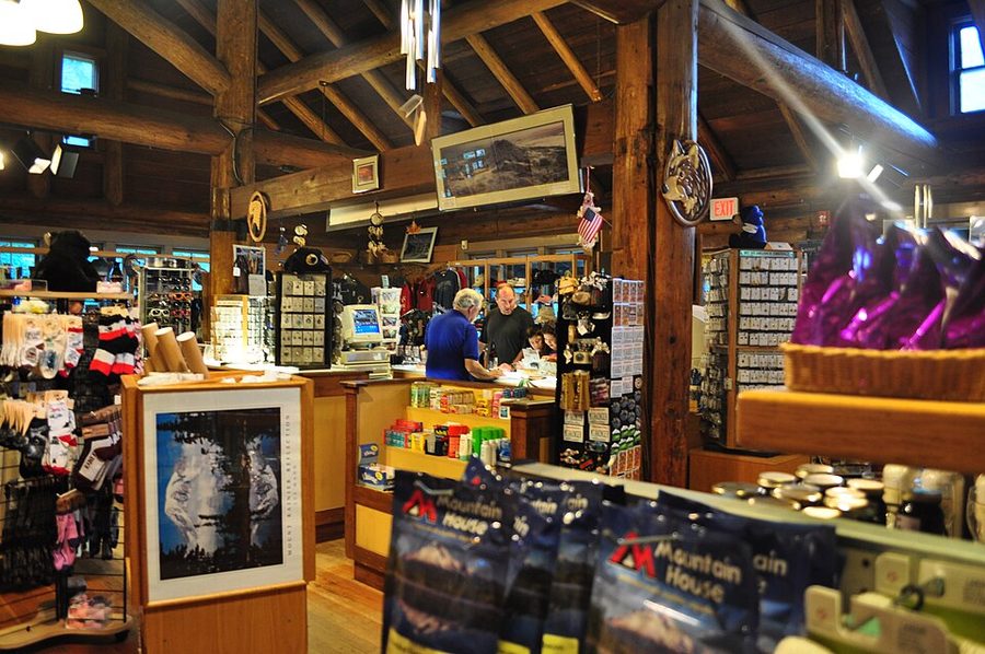 The interior of a historic general store, shelves stacked with goods.