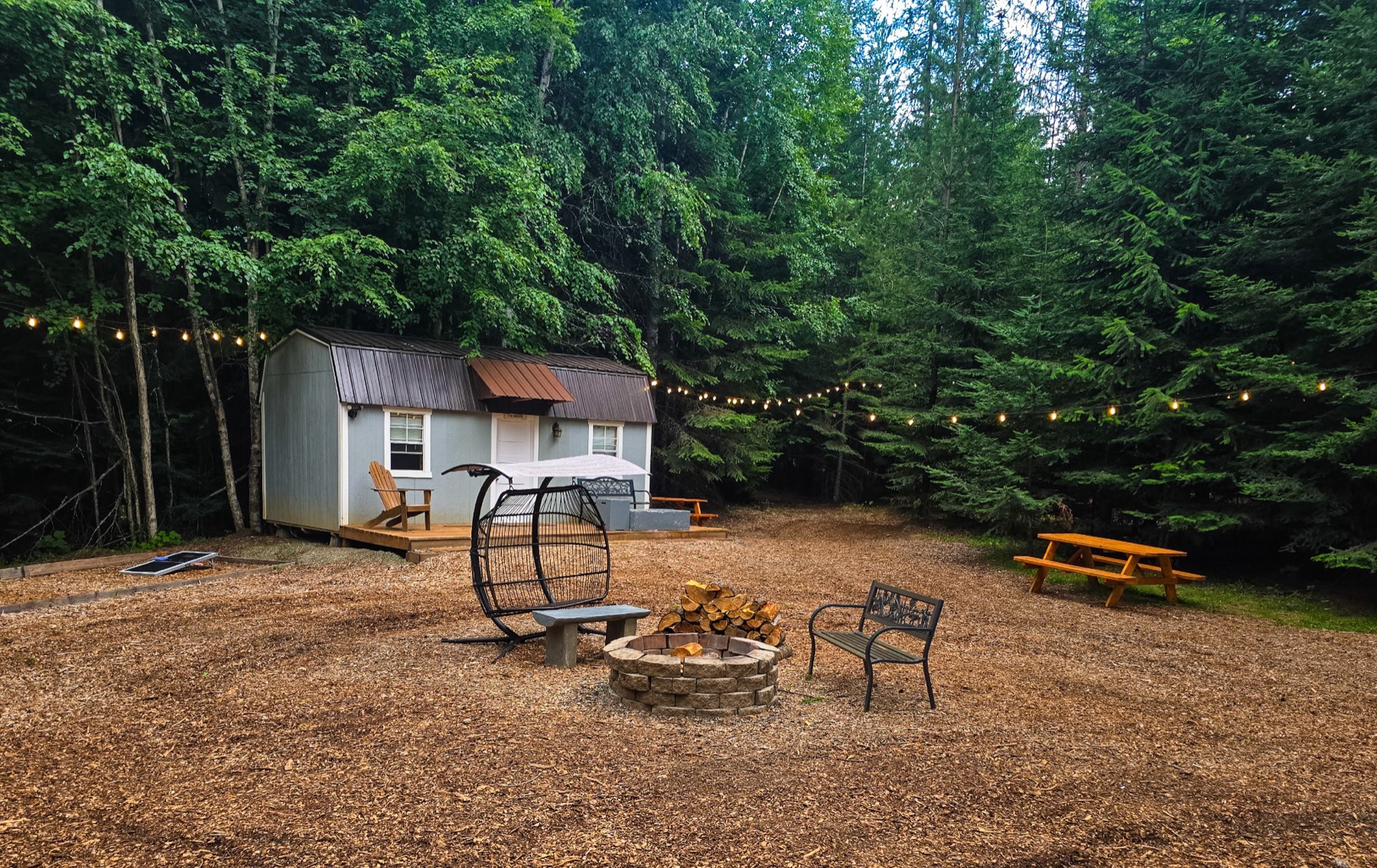 Fire pit gathering area with cabins